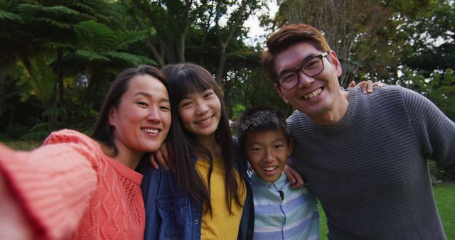 Happy family taking group selfie in park - Download Free Stock Images Pikwizard.com