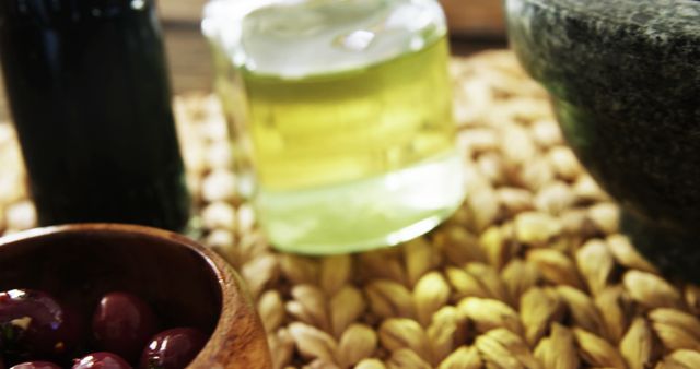 Olive Oil and Grapes on Woven Mat - Download Free Stock Images Pikwizard.com