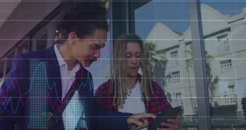 Diverse Business Professionals Analyzing Financial Data with Tablet