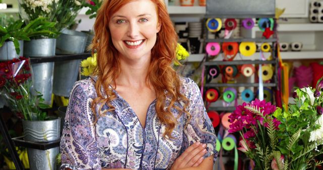 Portrait of happy florist standing with arms crossed in flower shop - Download Free Stock Photos Pikwizard.com