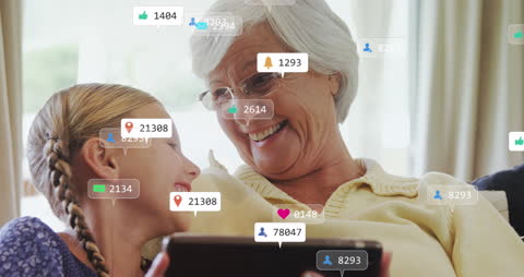 Grandmother and Granddaughter Sharing Screen Time with Social Media Alerts