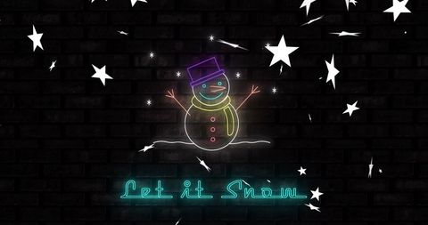 Neon snowman and stars against brick wall