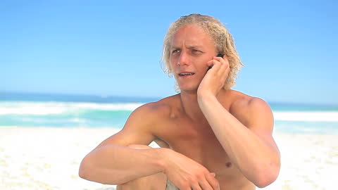 Blonde Man Enjoying Sunny Beach Call by Ocean Waves