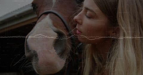 Young Woman Nuzzling Horse Muzzle Displaying Affectionate Bond