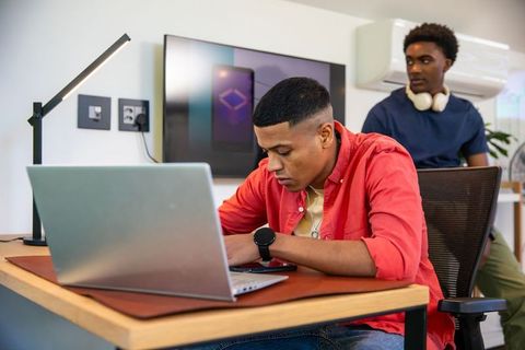 Focused collaboration between coworkers in modern office environment