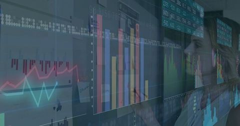 Business analyst interpreting complex data visualizations on large displays