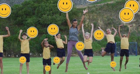 Joyful Children and Teacher Jumping with Happy Emoji Faces