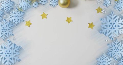 Winter snowflake border featuring gold stars and pale center space for holiday cards