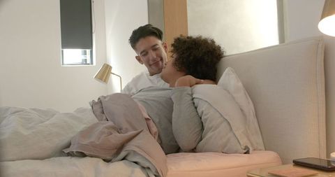 Cozy Couple Enjoying Relaxing Morning Together in Bed