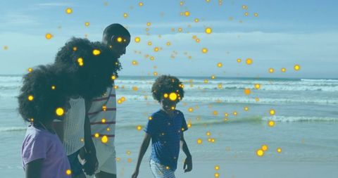 Happy Family Enjoying Beach Walk Under Sunlit Skies