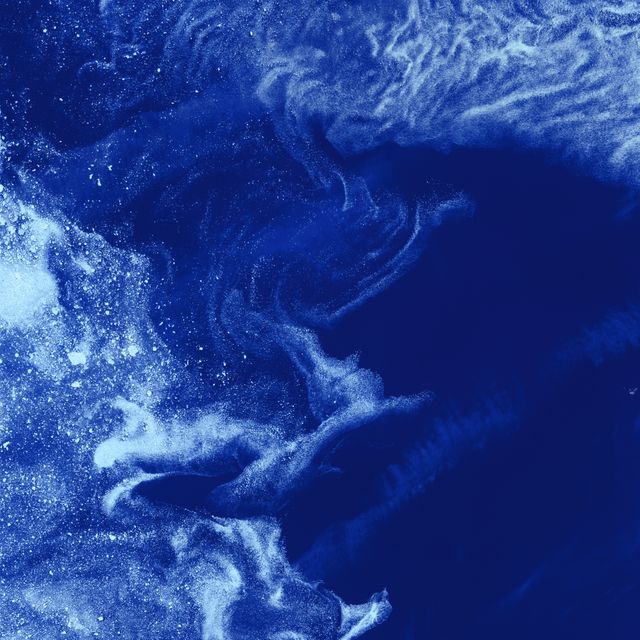 Image showing sea ice drifting through swirls of grease ice in Foxe Basin near Baffin Island in Canadian Arctic. Captured by Landsat 7 satellite, it depicts the formation and coalescing of sea ice. Useful for articles on climate science, NASA’s space missions, studies on Arctic conditions, and educational purposes about ice formation and oceanography.