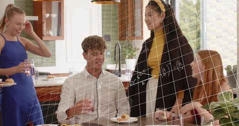 Young friends chatting and enjoying brunch at modern kitchen with math grid overlay