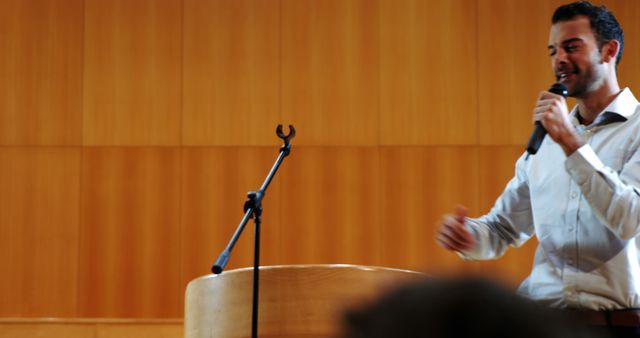 Confident Speaker Giving Presentation in Auditorium - Download Free Stock Images Pikwizard.com