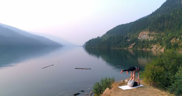 Couple Practicing Acro Yoga By Mountain Lake - Download Free Stock Images Pikwizard.com