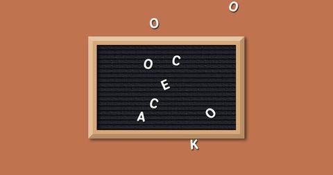 Scattered letters on blackboard school theme