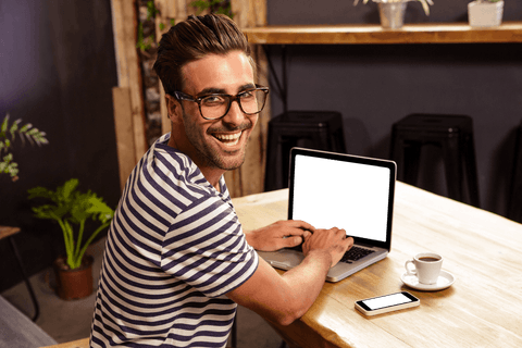 Transparent Joyful Man Using Laptop in Trendy Cafe Setting - Download Free Stock Videos Pikwizard.com