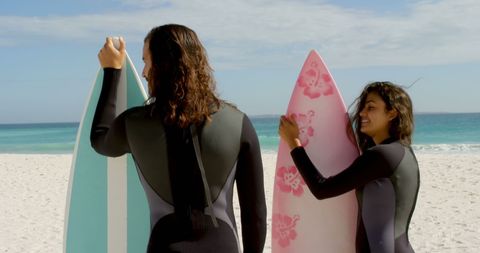 Couple with Surfboards Enjoying Beach Day - Download Free Stock Images Pikwizard.com