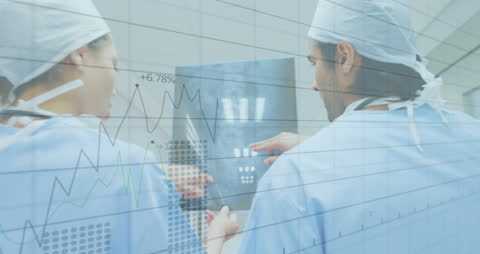 Biracial Doctors Analyzing X-Ray Overlayed with Digital Data