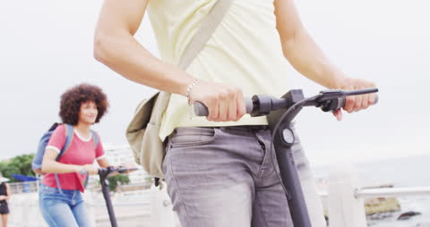 Joyful Ride by the Beach with Electric Scooters