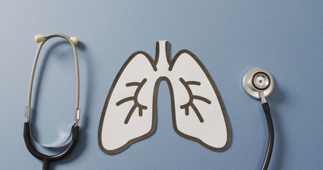 Image of close up of stethoscope with lungs on blue background. global medicine and healthcare concept.