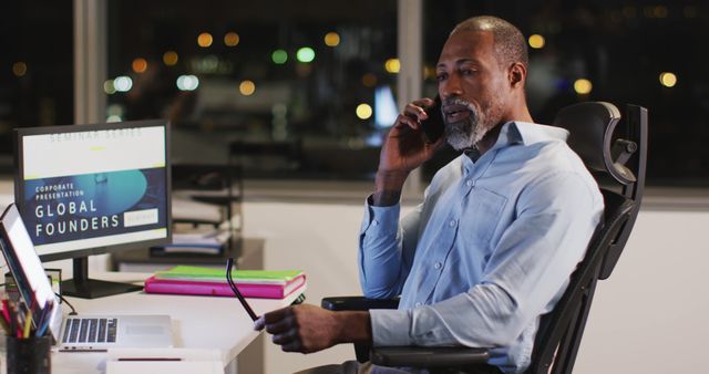 Businessman Talking on Phone in Office at Night - Download Free Stock Images Pikwizard.com