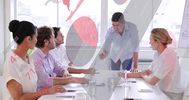 Business Meeting with Diverse Team Analyzing Data in Modern Office - Download Free Stock Images Pikwizard.com