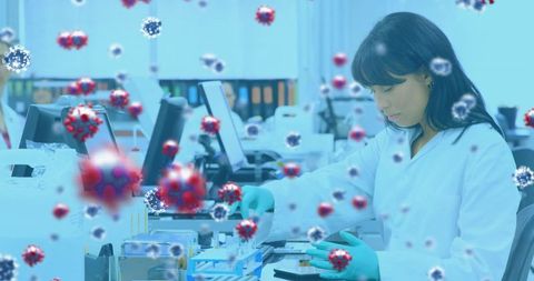 Medical professional in laboratory analyzing virus cells