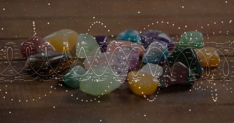 Polished Gemstones on Wooden Table with Vibrant Wave Effect