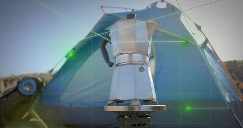 Outdoor coffee brewing with moka pot at campsite