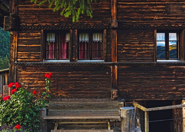 Rustic Wooden Cabin with Red Flowers in Alpine Setting - Download Free Stock Photos Pikwizard.com
