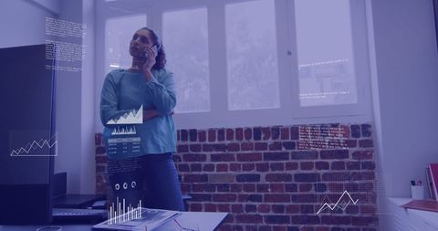 Businesswoman Engaged in Phone Call with Virtual Financial Data