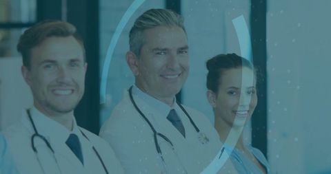 Smiling Medical Team Standing Confidently in Clinic Corridor