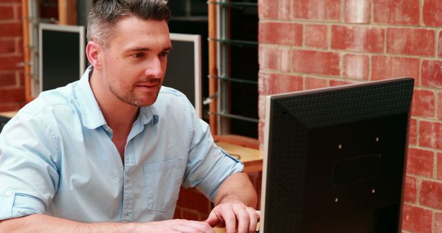 Focused Man Working on Computer in Office - Download Free Stock Images Pikwizard.com