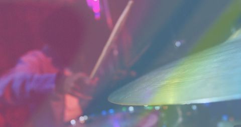 Abstract view of drummer performing vibrant live show