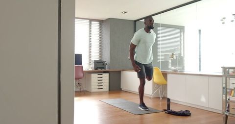 Man Practicing Balance Exercise in Modern Home Office