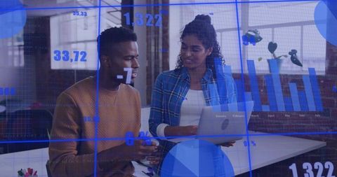 Collaborating on laptop, analyzing dashboards and charts with blue digital data overlays