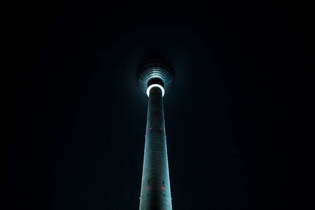 Illuminated Tower at Night from Low Angle Perspective - Download Free Stock Photos Pikwizard.com
