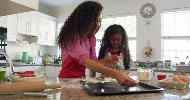 Young Biracial Woman Teaching Girl Baking in Bright Kitchen, Bonding and Learning Cooking - Download Free Stock Images Pikwizard.com