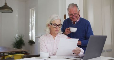 Senior Couple Calculating Home Finances Over Coffee - Download Free Stock Images Pikwizard.com