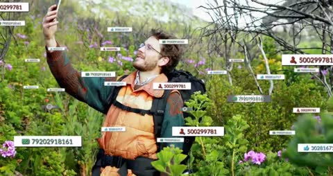 Hiker Takes Selfie Surrounded by Digital Data Tags in Nature