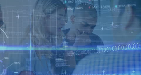 Young Professionals Analyzing Financial Data and Digital Interfaces