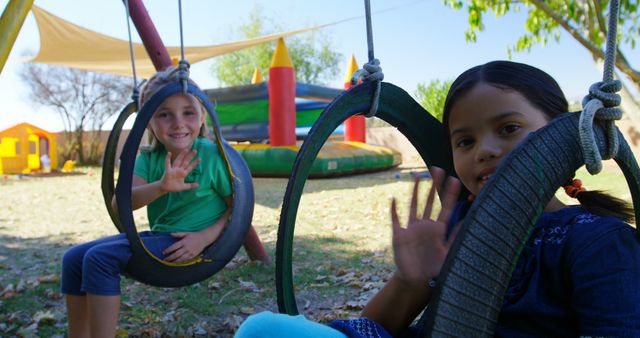 Children Playing on Tire Swings in Outdoor Playground - Download Free Stock Images Pikwizard.com