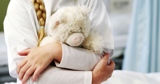 Free Girl holding a teddy bear on bed in bedroomgirl holding a teddy bear  on bed in bedroom at homehome Photos, Pictures and Images - PikWizard