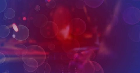 Abstract bokeh light pattern with red to purple gradient