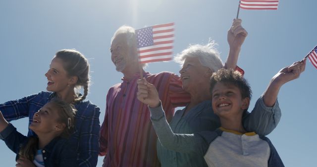 Joyful Multigenerational Family Celebrates with American Flags Outdoors - Download Free Stock Images Pikwizard.com