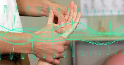 Caregiver holding patient wrist for hand therapy and rehab with digital waveform overlay