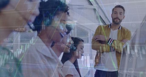 Multinational team engaging financial technology with overlay graphics