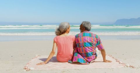 Senior African American Couple Enjoying Sunny Day at Beach