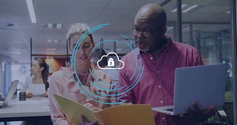 Professionals collaborating in modern office on data security solution