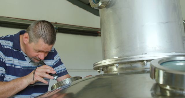 Brewmaster Inspecting Fermentation Tank in Brewery - Download Free Stock Images Pikwizard.com